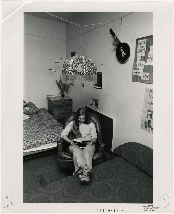 Student reads in her dorm room