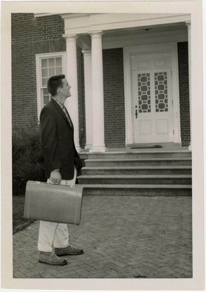 Jim Cassidy (with suitcase)