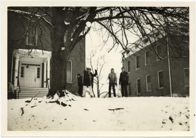 Students outside West Hall in the snow